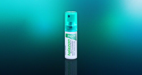 Ein Mundspray von Onedroponly steht vor einem grünen Verlaufshintergrund und symbolisiert moderne Mundpflege.